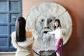 Rome, Italy Ã¢â¬â October 10, 2018: Beautiful asian women photograph each other in front of the mouth of truth Bocca della Verit Royalty Free Stock Photo